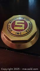 MaxSold Auction: Very Collectible Stutz Brass Center hub Cap, 2.5–3.5 in (Logo) (see also lot 16) - Sun Valley (California, USA) SELLER MANAGED Estate Sale Online Auction -  Wentworth Street