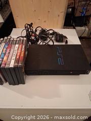 MaxSold Auction: PlayStation 2 Console with Game Discs & Cables (NTSC) - Markham (Ontario, Canada) SELLER MANAGED Downsizing Online Auction - Adam Sellers Street (CONDO)