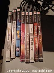 MaxSold Auction: PlayStation 2 Console with Game Discs & Cables (NTSC) - Markham (Ontario, Canada) SELLER MANAGED Downsizing Online Auction - Adam Sellers Street (CONDO)