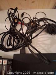 MaxSold Auction: PlayStation 2 Console with Game Discs & Cables (NTSC) - Markham (Ontario, Canada) SELLER MANAGED Downsizing Online Auction - Adam Sellers Street (CONDO)