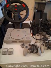 MaxSold Auction: Sony PlayStation (PS1) Console with Accessories Bundle - Markham (Ontario, Canada) SELLER MANAGED Downsizing Online Auction - Adam Sellers Street (CONDO)