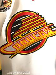 MaxSold Auction: Canucks Signed Jersey A - New Westminster (British Columbia, Canada) PARTNER MANAGED Moving Online Auction - 8th Avenue