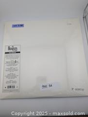 MaxSold Auction: The White Album by The Beatles- Sealed Vinyl Record(2014) - Langley (British Columbia, Canada) SELLER MANAGED Reseller Online Auction - 68 Avenue