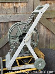 MaxSold Auction: Garden Wheelbarrow, Hose Reel Cart, and Orbit Sprinklers - Victoria (British Columbia, Canada) SELLER MANAGED Moving Online Auction - Toronto Street