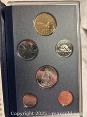 MaxSold Auction: Set of 3 Royal Canadian Mint Coin Sets  - Victoria (British Columbia, Canada) SELLER MANAGED Moving Online Auction - Toronto Street