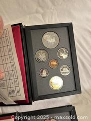 MaxSold Auction: Set of 3 Royal Canadian Mint Proof Sets  - Victoria (British Columbia, Canada) SELLER MANAGED Moving Online Auction - Toronto Street