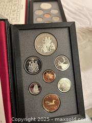 MaxSold Auction: Set of 3 Royal Canadian Mint Proof Sets  - Victoria (British Columbia, Canada) SELLER MANAGED Moving Online Auction - Toronto Street