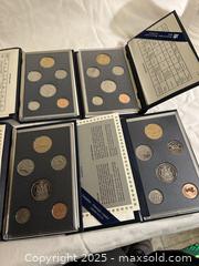MaxSold Auction: Set of 4 Royal Canadian Mint Proof Sets  - Victoria (British Columbia, Canada) SELLER MANAGED Moving Online Auction - Toronto Street