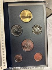 MaxSold Auction: Set of 4 Royal Canadian Mint Proof Sets  - Victoria (British Columbia, Canada) SELLER MANAGED Moving Online Auction - Toronto Street