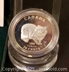 MaxSold Auction: Canadian Sterling .50 Cent Pieces 1999  Cymric Cat & 2004 Easter Lily  - Aurora (Ontario, Canada) PARTNER MANAGED Downsizing Online Auction - Murray Drive