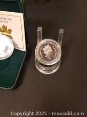 MaxSold Auction: Canadian Sterling .50 Cent Pieces 1999  Cymric Cat & 2004 Easter Lily  - Aurora (Ontario, Canada) PARTNER MANAGED Downsizing Online Auction - Murray Drive