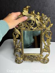 MaxSold Auction: Large Victorian Solid Brass Cherub Putti Display Mirror  - Victoria (British Columbia, Canada) PARTNER MANAGED Estate Sale Online Auction PART 1 - Bay Street