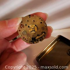 MaxSold Auction: Mixed Clock Parts Waltham with Tin - Grimsby (Ontario, Canada) SELLER MANAGED Reseller Online Auction - Mountview Avenue