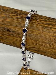 MaxSold Auction: JJI 925 Sterling Silver blue and white stones tennis bracelet - Menlo Park (California, USA) SELLER MANAGED Downsizing Online Auction - Henderson Place