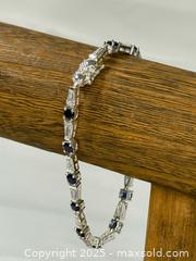 MaxSold Auction: JJI 925 Sterling Silver blue and white stones tennis bracelet - Menlo Park (California, USA) SELLER MANAGED Downsizing Online Auction - Henderson Place
