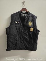 MaxSold Auction: Black SWAT costume vest, size XL, with patches and toy police badge. Good condition - Vancouver (British Columbia, Canada) SELLER MANAGED Reseller Online Auction - East 7th Avenue (STORAGE)