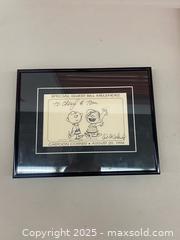 MaxSold Auction: This is a framed, hand-drawn sketch featuring the Peanuts characters Charlie Brown and Lin - Vancouver (British Columbia, Canada) SELLER MANAGED Moving Online Auction - West Broadway (CONDO)
