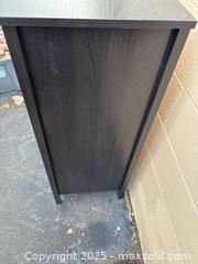 MaxSold Auction: Tall Narrow Bookshelf / Storage Cabinet, Black Wood-Grain Laminate - Decatur (Georgia, USA) SELLER MANAGED Reseller Online Auction - Snapfinger Woods Drive (STORAGE)