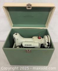 MaxSold Auction: ** RARE ** White Singer Featherweight 221K Sewing Machine in Original Case &#38; Acces works. - Toronto (Ontario, Canada) PARTNER MANAGED Reseller Online Auction - Queen Street West