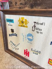 MaxSold Auction: Framed Embroidered/Tapestry Sampler with Corporate Logos - Garden City (Georgia, USA) SELLER MANAGED Downsizing Online Auction - Bryce Industrial Drive