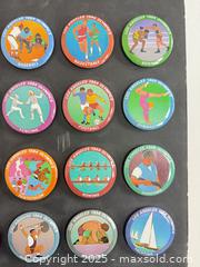 MaxSold Auction: Collection of 1984 Olympic buttons mounted on black cardboard - Vancouver (British Columbia, Canada) SELLER MANAGED Reseller Online Auction - Main Street
