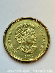 MaxSold Auction: Canada 2012 Loonie — Grey Cup 100th A - Surrey (British Columbia, Canada) SELLER MANAGED Downsizing Online Auction -  75a Avenue