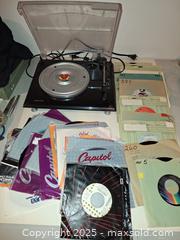MaxSold Auction: USB Turntable and 45's From 1970's and 1980's A - Surrey (British Columbia, Canada) SELLER MANAGED Downsizing Online Auction -  75a Avenue