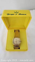 MaxSold Auction: Concord Quartz Gold-Tone Cushion Case Watch, Silver-Champagne Dial - St. Petersburg (Florida, USA) SELLER MANAGED Estate Sale Online Auction - Sunshine Skyway Lane South (CONDO)