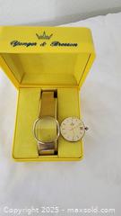 MaxSold Auction: Concord Quartz Gold-Tone Cushion Case Watch, Silver-Champagne Dial - St. Petersburg (Florida, USA) SELLER MANAGED Estate Sale Online Auction - Sunshine Skyway Lane South (CONDO)