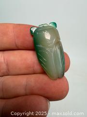 MaxSold Auction: Carved green Calchedony cicada pendant - Concord (California, USA) SELLER MANAGED Estate Sale Online Auction - Landana Drive