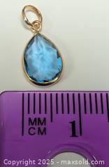 MaxSold Auction: Certified 10K(0.57g),  BLUE TOPAZ (2.2ct) PENDANT - Toronto (Ontario, Canada) PARTNER MANAGED Downsizing Online Auction - Queen Street East