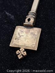 MaxSold Auction: Ethiopian Coptic Brass Processional Handheld Cross - Victoria (British Columbia, Canada) PARTNER MANAGED Estate Sale Online Auction - Hillside Avenue