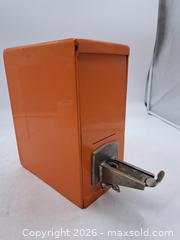 MaxSold Auction: Vintage Orange Coin-Operated Drop Bank with Lever - Victoria (British Columbia, Canada) PARTNER MANAGED Estate Sale Online Auction - Hillside Avenue