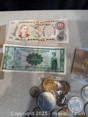 MaxSold Auction: A LOT OF FOREIGN COINS AND PAPER MONEY. - Hamilton (Ontario, Canada) SELLER MANAGED Estate Sale Online Auction - St. Clair Avenue