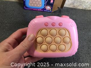 MaxSold Auction: Quick Push Video Game Fidget Toy - Hamilton (Ontario, Canada) SELLER MANAGED Downsizing Online Auction - Moffat Road