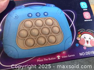 MaxSold Auction: Quick Push Video Game Fidget Toy - Hamilton (Ontario, Canada) SELLER MANAGED Downsizing Online Auction - Moffat Road