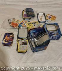 MaxSold Auction: Pokémon Card Lot with 2–3 Storage Tins, 50–100 Cards - Toronto (Ontario, Canada) SELLER MANAGED Downsizing Online Auction - Rutherford Avenue