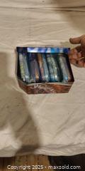 MaxSold Auction: Pokémon Card Lot with 2–3 Storage Tins, 50–100 Cards - Toronto (Ontario, Canada) SELLER MANAGED Downsizing Online Auction - Rutherford Avenue