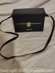 MaxSold Auction: Tasco Porro Prism Binoculars with Case and Strap - Toronto (Ontario, Canada) SELLER MANAGED Downsizing Online Auction - Rutherford Avenue