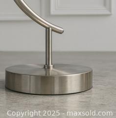 MaxSold Auction: Vintage Brushed Steel Arc Table Lamp — Modern Industrial Elegance - Newmarket (Ontario, Canada) SELLER MANAGED Downsizing Online Auction - Brimson Drive (STORAGE)