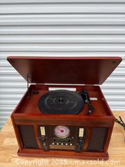 MaxSold Auction: Vintage-style Tabletop Record Player & Radio Console, Cherry - Maple Ridge (British Columbia, Canada) PARTNER MANAGED Estate Sale Online Auction - Blanshard Street (STORAGE)