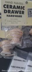 MaxSold Auction: Hand-Painted Beige Ceramic Drawer Knobs &#38; Black Metal Door Knobs - Toronto (Ontario, Canada) SELLER MANAGED Downsizing Online Auction - Wilson Avenue (CONDO)