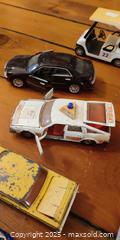 MaxSold Auction: 12 Die-Cast Cars – Matchbox Lesney, Police Car, Golf Cart, Mini Cooper, Vintage Sed - Toronto (Ontario, Canada) SELLER MANAGED Moving Online Auction - 1/2  Wellesley Street East
