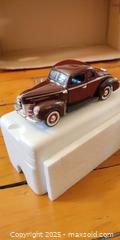 MaxSold Auction: 1940 Ford Deluxe Coupe Die-Cast Model – Burgundy, Detailed Interior/Engine - Toronto (Ontario, Canada) SELLER MANAGED Moving Online Auction - 1/2  Wellesley Street East