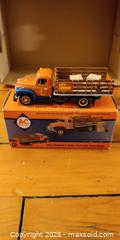 MaxSold Auction: 1955 Diamond-T Stake Truck Die-Cast Model by AC – 1:34 Scale with Parts Boxes & Original B - Toronto (Ontario, Canada) SELLER MANAGED Moving Online Auction - 1/2  Wellesley Street East