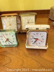 MaxSold Auction: Group of 4 Vintage Travel Alarm Clocks – Quartz & Mechanical Styles  - Toronto (Ontario, Canada) SELLER MANAGED Moving Online Auction - 1/2  Wellesley Street East