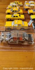 MaxSold Auction: Lot of 26 Die-Cast Vehicles – Taxis, Police Cars, Vintage & Mixed Models - Toronto (Ontario, Canada) SELLER MANAGED Moving Online Auction - 1/2  Wellesley Street East