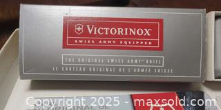 MaxSold Auction: Pair of Victorinox Swiss Army Knives – Classic Models, Red, With Original Boxes & Manuals - Toronto (Ontario, Canada) SELLER MANAGED Moving Online Auction - 1/2  Wellesley Street East