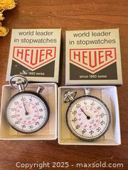 MaxSold Auction: Pair of Vintage Heuer Swiss Stopwatches with Original Boxes (2)  - Toronto (Ontario, Canada) SELLER MANAGED Moving Online Auction - 1/2  Wellesley Street East