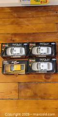 MaxSold Auction: Set of 4 Die-Cast Model Cars – Bburago & Maisto (Boxed) - Toronto (Ontario, Canada) SELLER MANAGED Moving Online Auction - 1/2  Wellesley Street East
